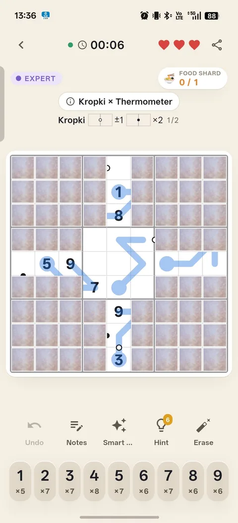 A Kropki × Thermometer board: thermometer bars and black and white dots sharing the same grid under fog